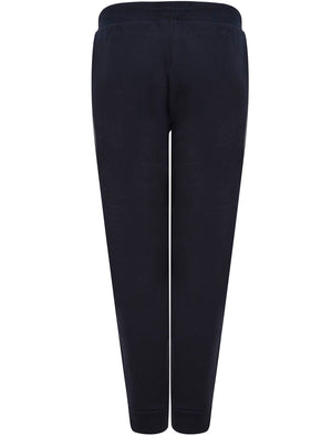 Kruze Brushback Fleece Cuffed Joggers with Foil Motif in Sky Captain Navy - Tokyo Laundry