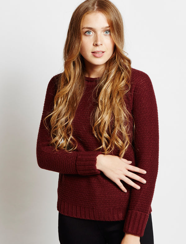 Amara Reya red jumper