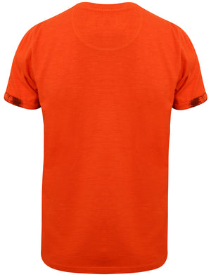 Akamu Printed Roll Sleeve T-Shirt with Pocket in Paprika - Tokyo Laundry